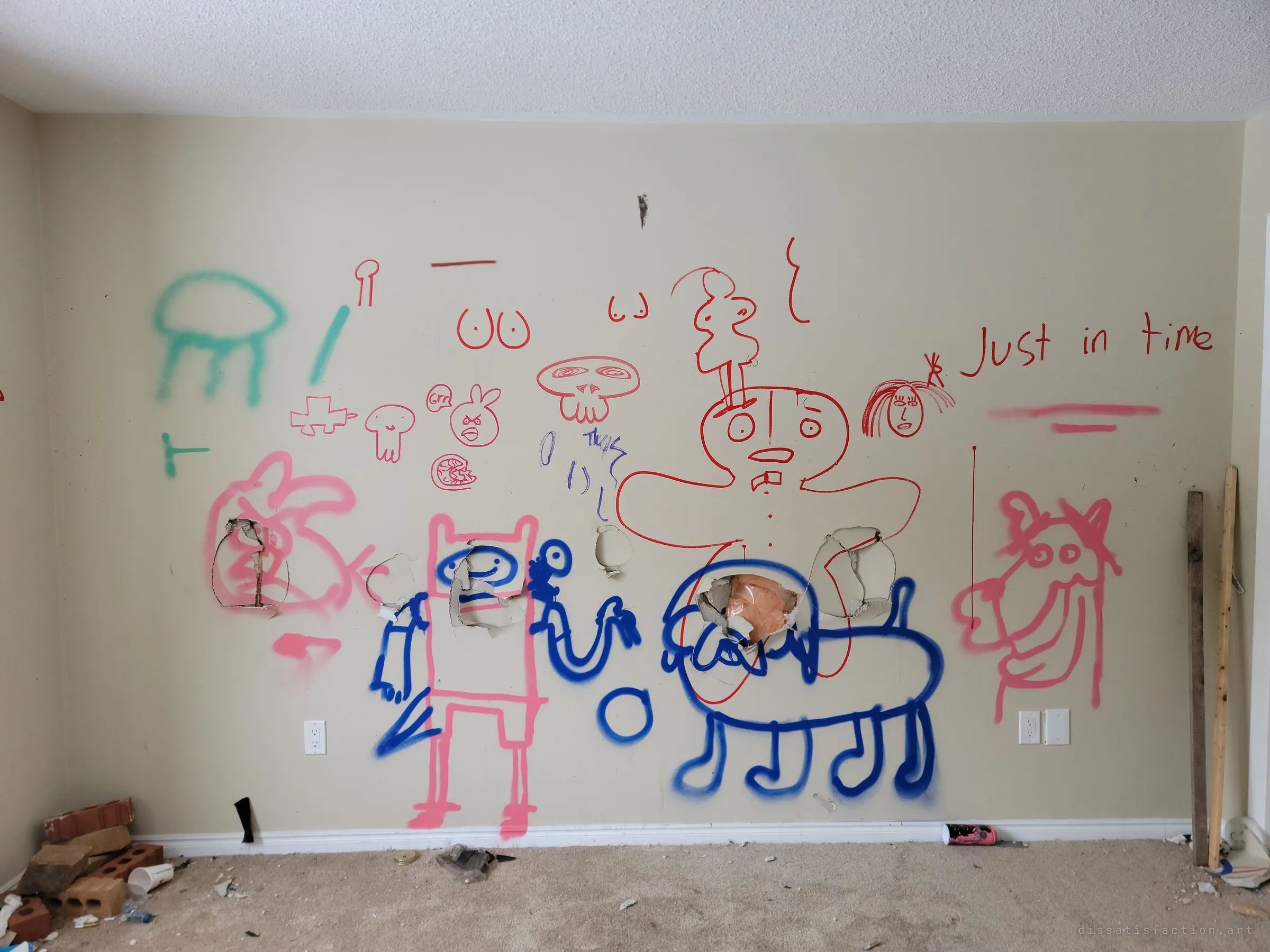 A bedroom wall covered in spray-painted and marker cartoons, including cartoon characters and an angry bird doodle, punched through with fist-sized holes, with bricks and litter on the carpet. The playful drawings sit oddly against the vandalised, gutted room.