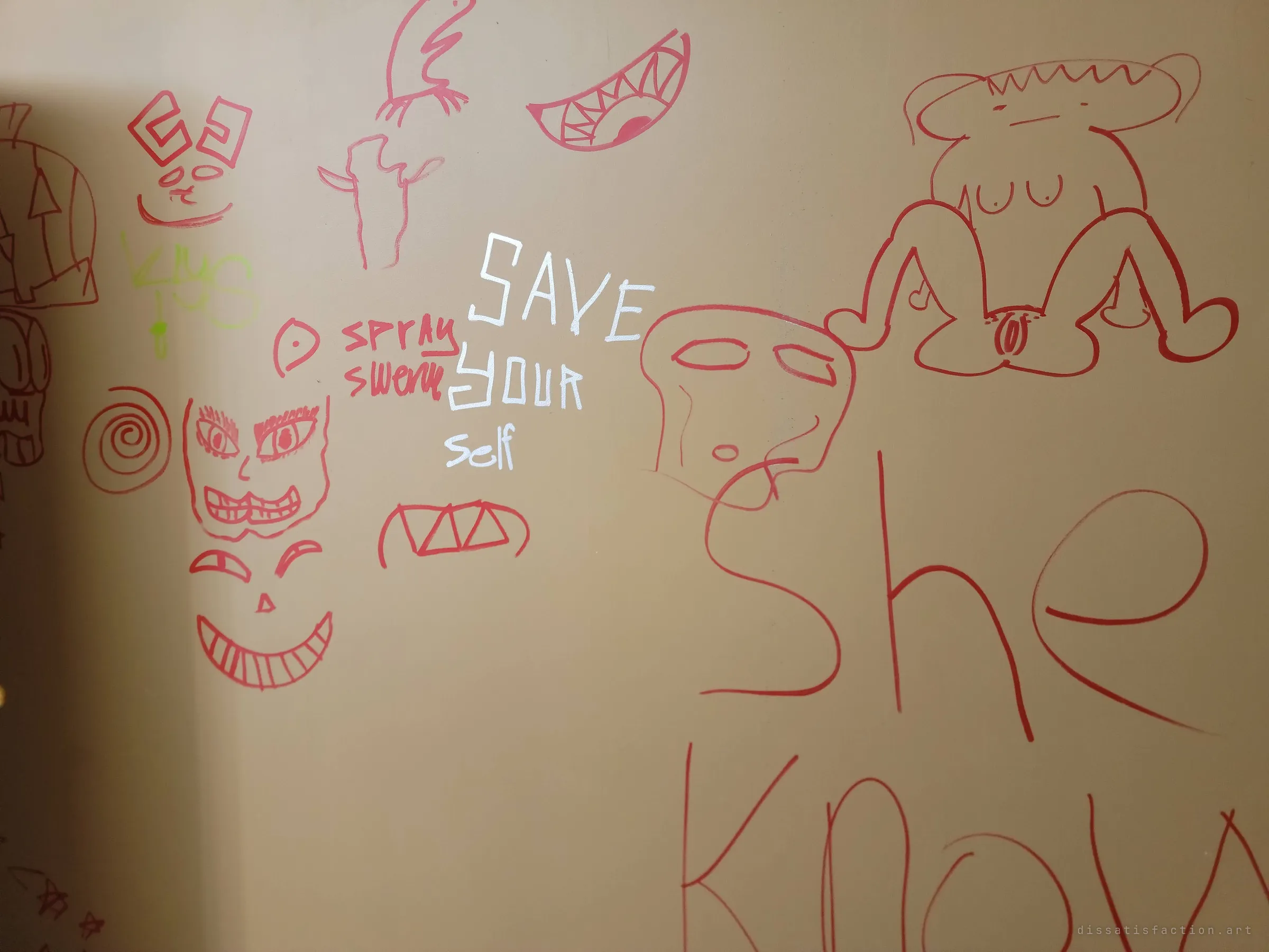 A wall covered in marker doodles: grinning faces, jagged teeth, a crude nude figure and a silver scrawl telling the reader to save themselves.
