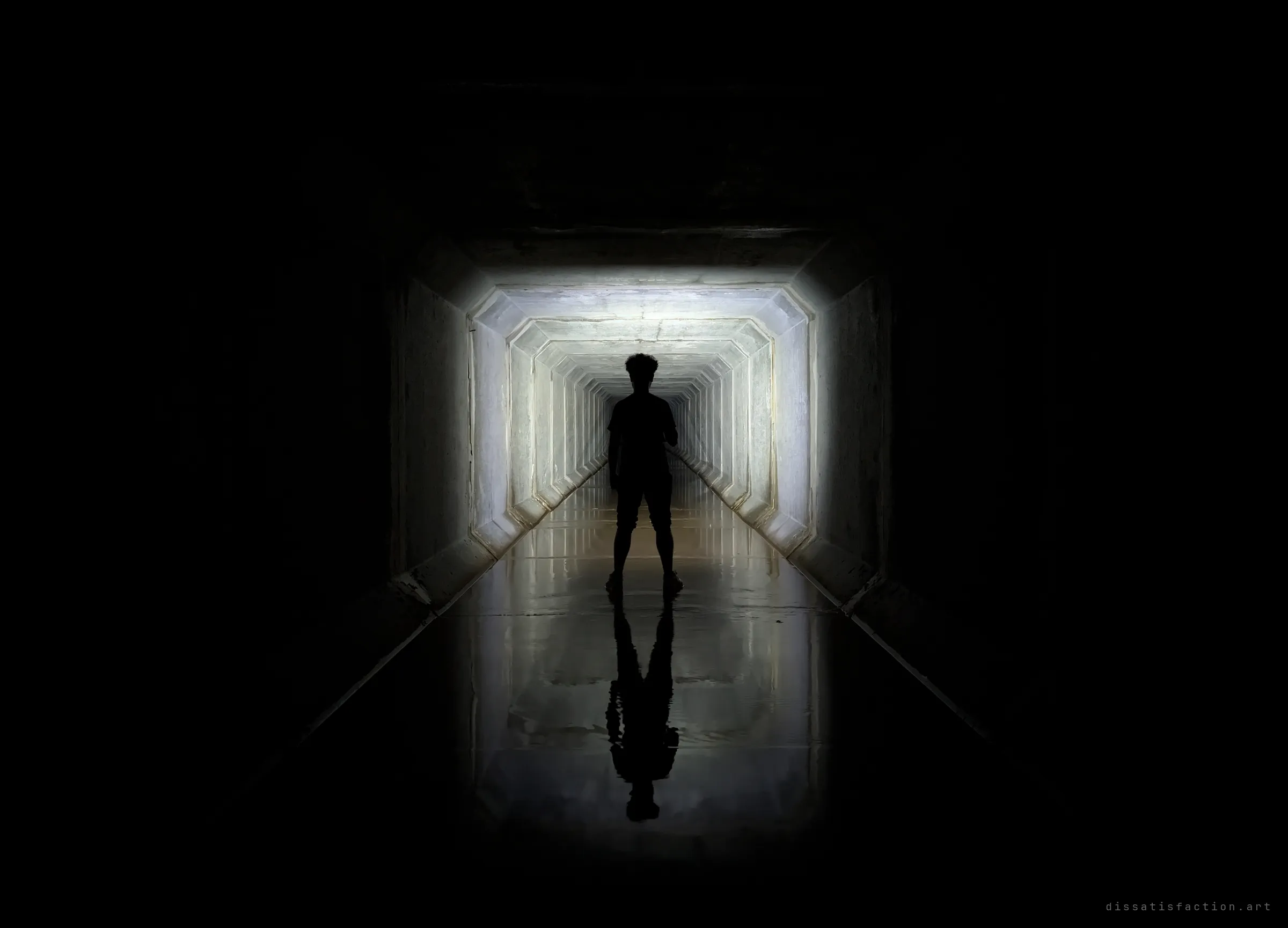 A silhouetted explorer stands centred in the flashlit box drain, his reflection mirrored in the water below. The frames of the tunnel stack into a bright corridor behind him.
