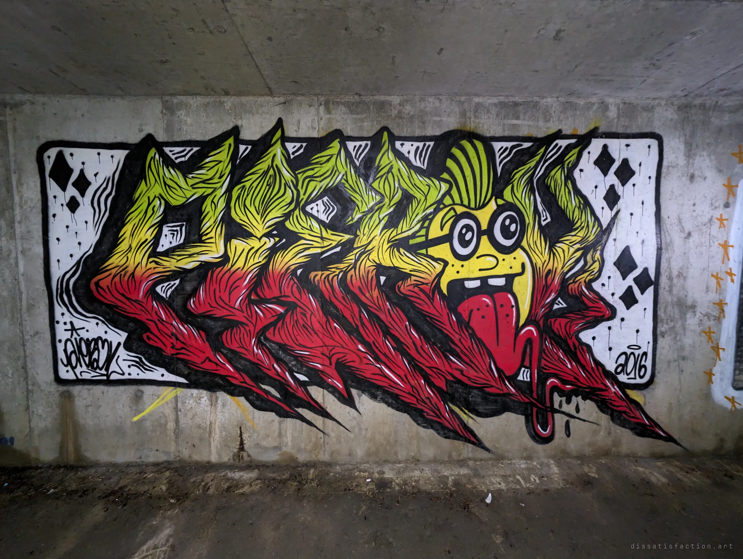 A spiky yellow-to-red letter piece with a grinning, tongue-out character, framed by a white card-suit panel and dated 2016. It shows how long painters have been using this passage.