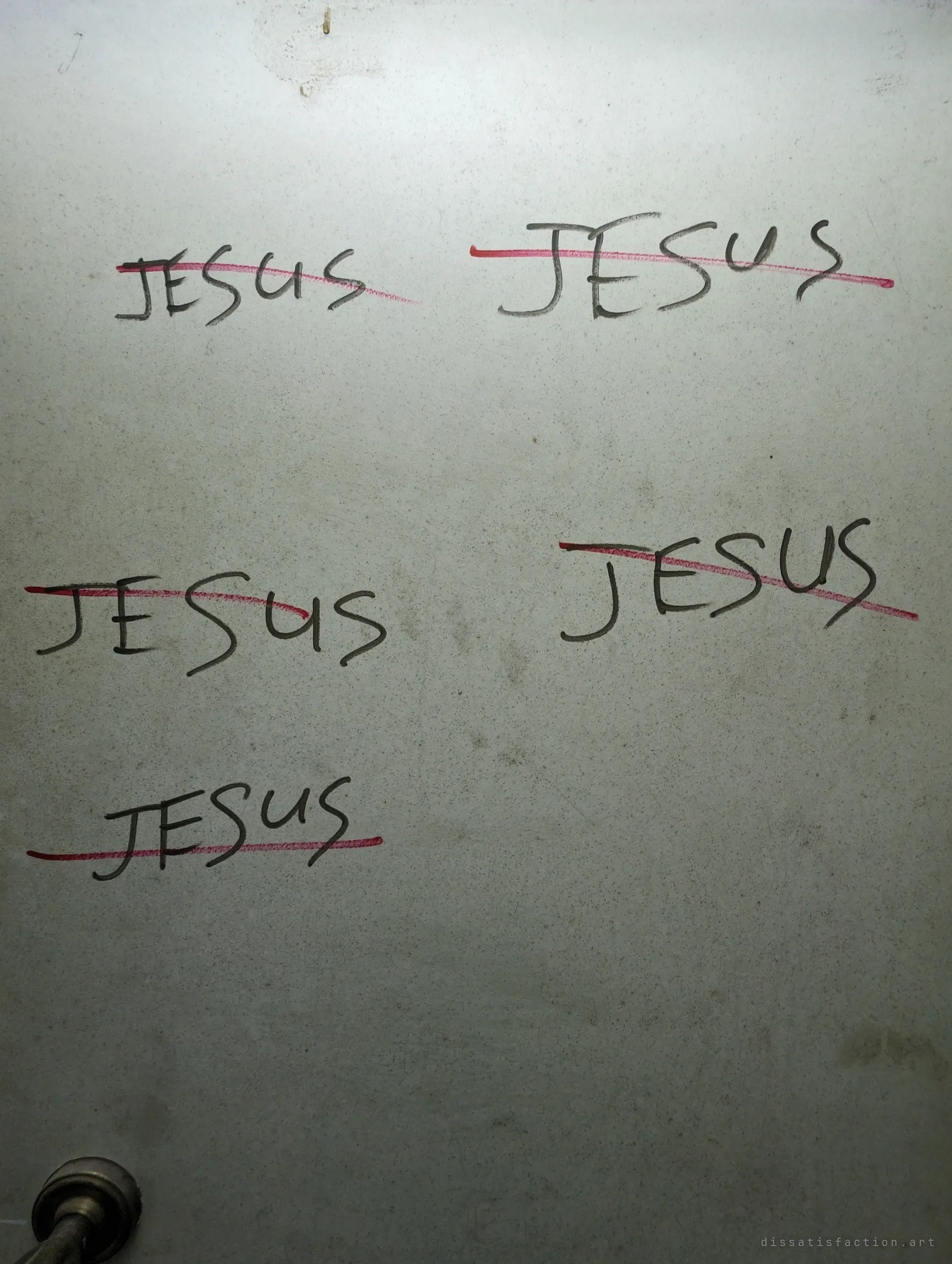 A grey door panel with the same name written five times in black marker, each one crossed out with a red line, above a worn brass knob. The pattern of writing and erasing runs through the whole house.