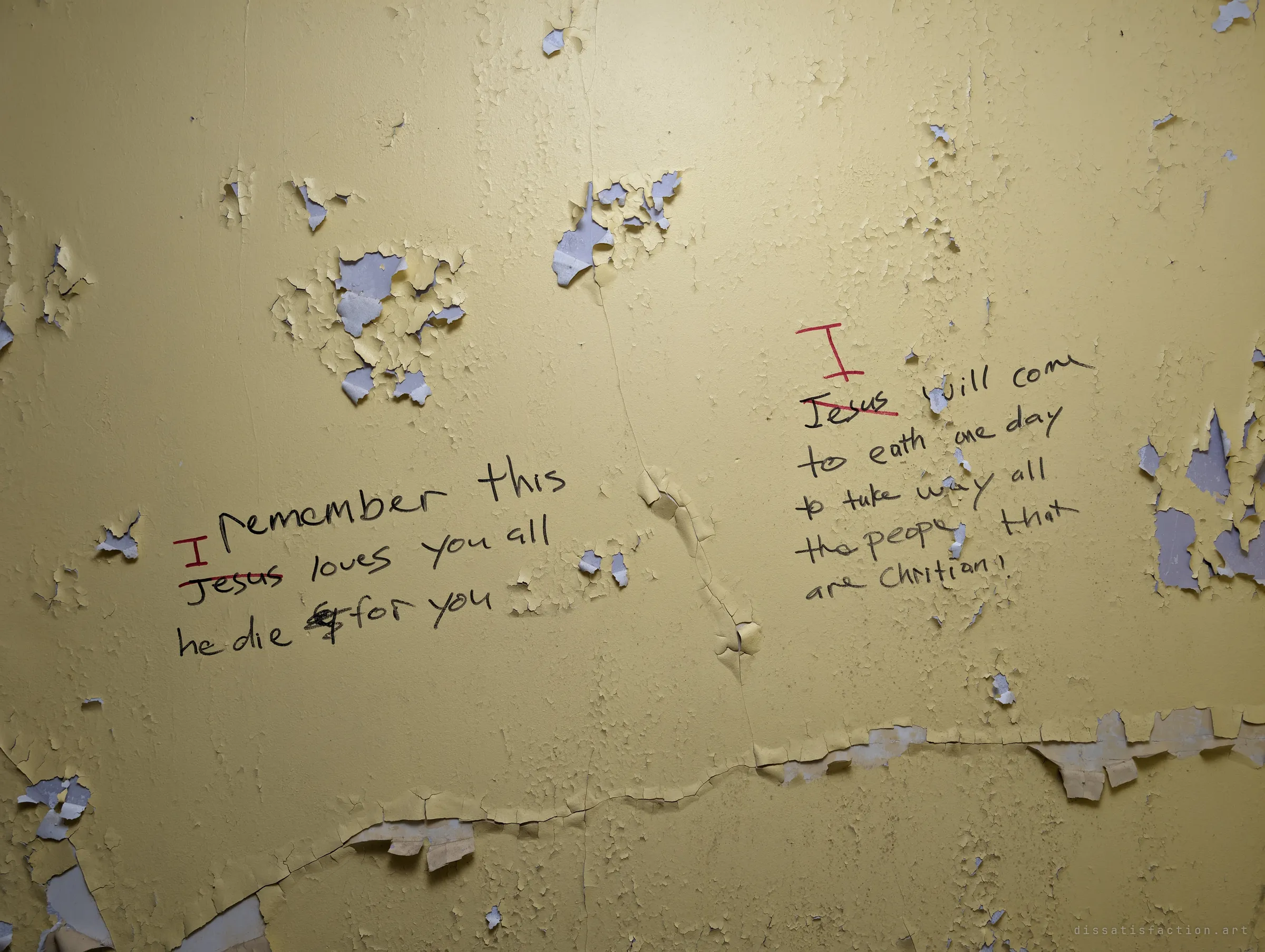 Flaking yellow paint around two handwritten passages about love and the end of days, the name in each again struck out in red and replaced with 'I'. The paint is lifting away beneath the words.