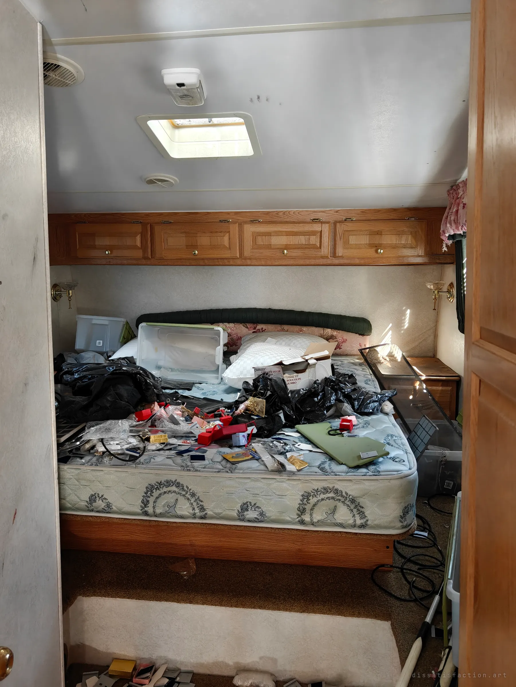 The back bedroom, where the bed is buried under ripped-open jewellery boxes, display cards, bin liners and emptied storage tubs. It is the scene of the heist the album is named for.