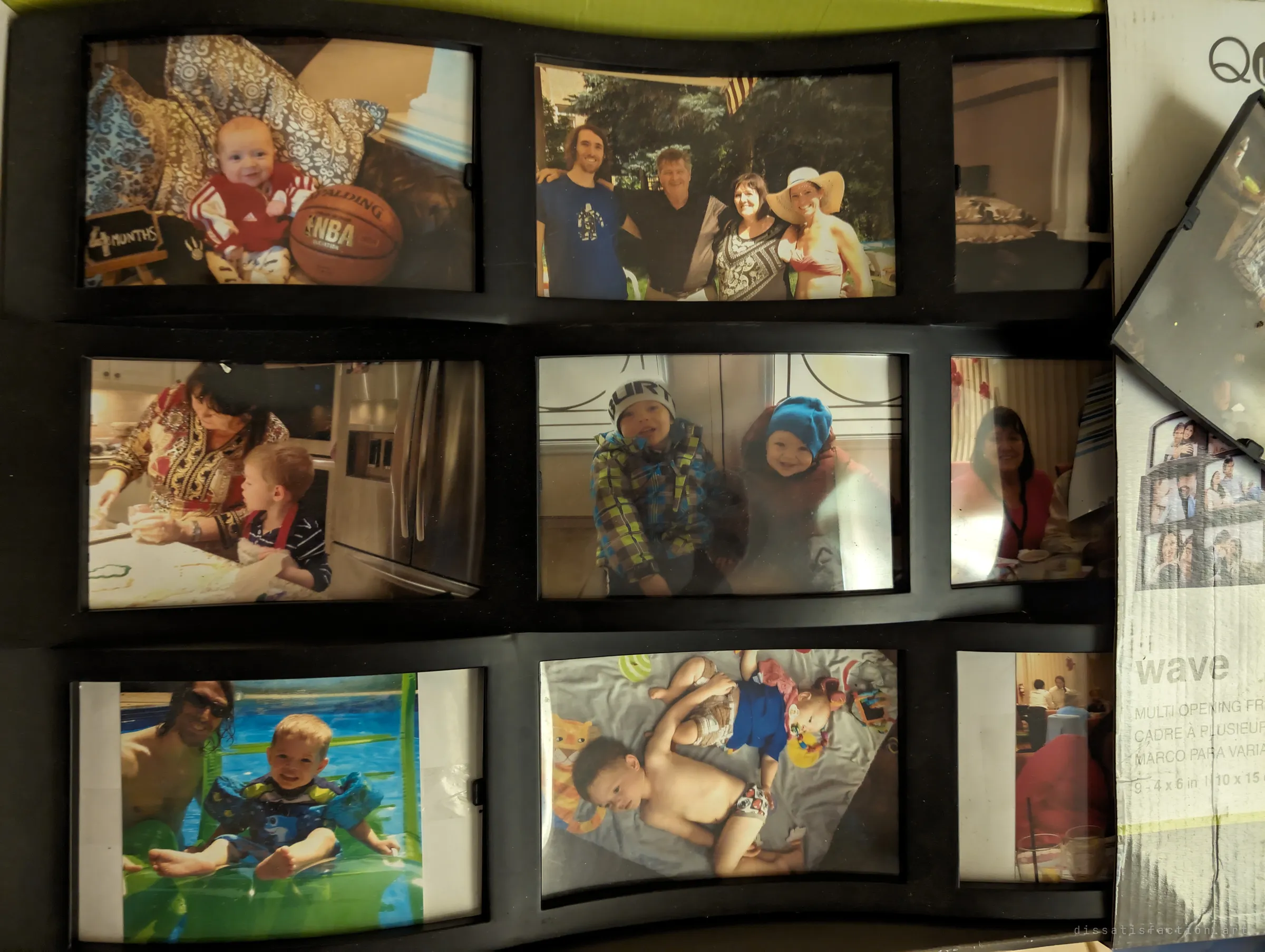 A multi-opening picture frame still filled with family photos: babies, a backyard gathering, a pool day and a kitchen scene. It sits on its own retail box, never hung.