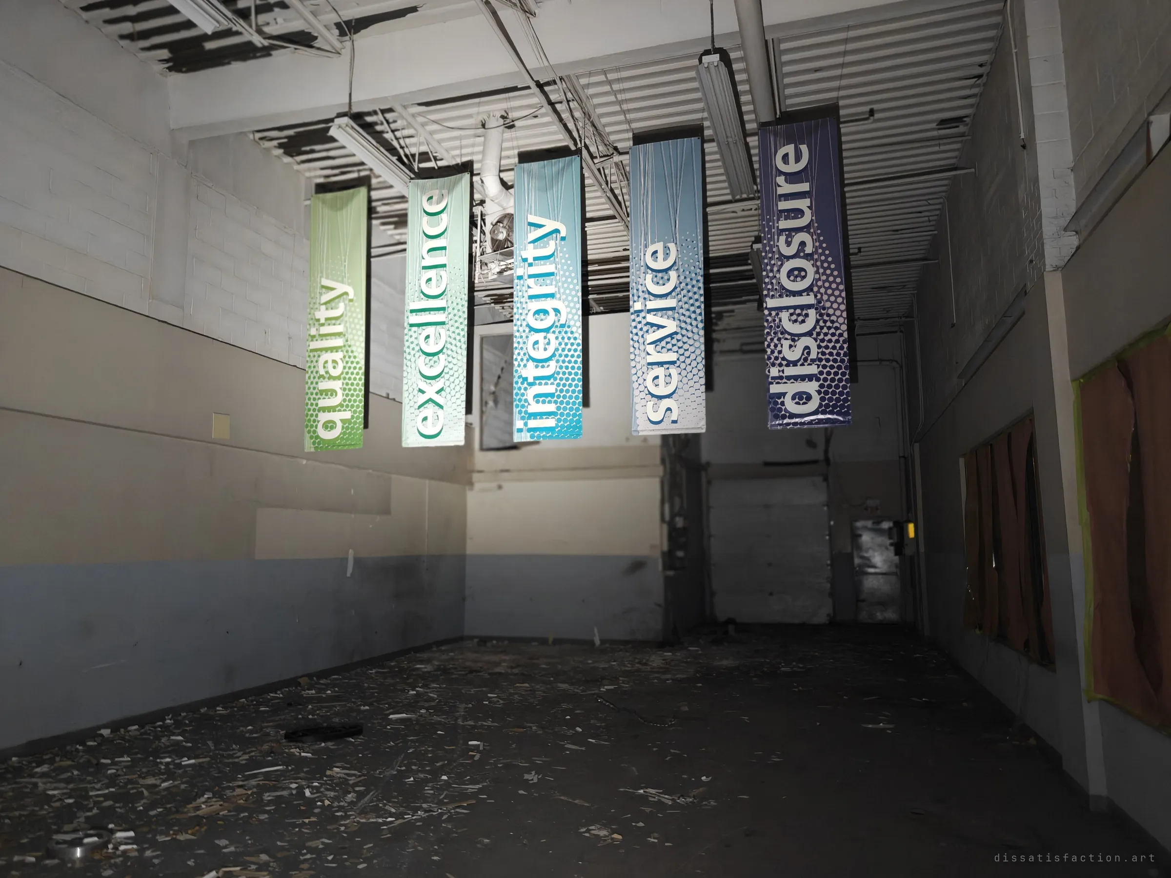 Five coloured corporate-value banners hang from a stripped ceiling over a debris-strewn back room with a loading door at the end. The slogans read hollow in the wreckage.